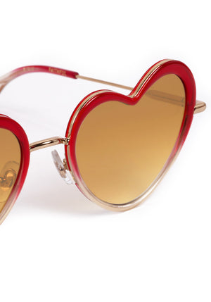 FAITHFUL | 18K + Cherry on Top Handcrafted, luxury, heart shaped red Mardi Gras acetate and 18K stainless steel KREWE sunglasses