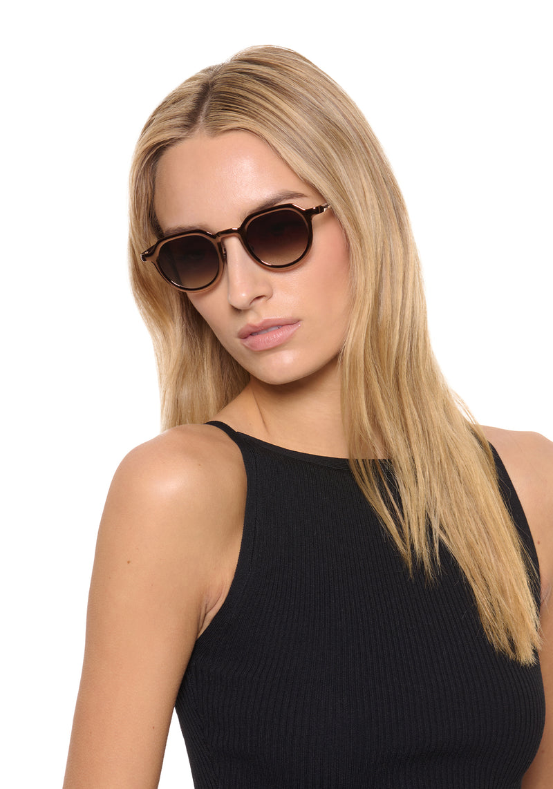 GALVAN | Bronze Chroma + Venezia Handcrafted, luxury bronze chrome stainless steel medium sized geometric KREWE sunglasses womens model | Model: Isabelle