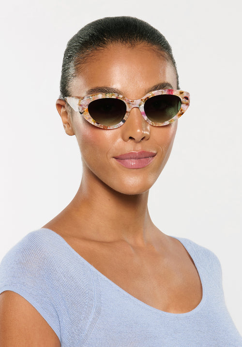 IRENE | Handcrafted, luxury glace acetate medium sized upswept oval wrap KREWE sunglasses womens model | Model: Sasha