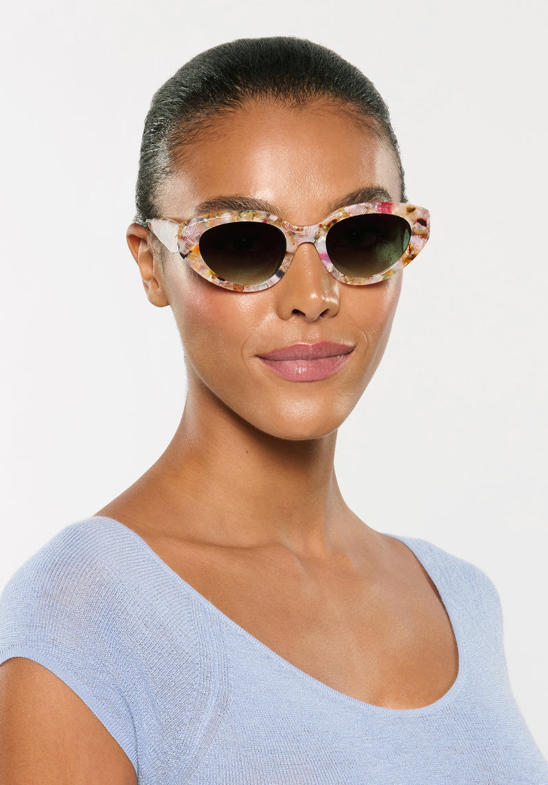 IRENE | Handcrafted, luxury glace acetate medium sized upswept oval wrap KREWE sunglasses womens model | Model: Sasha