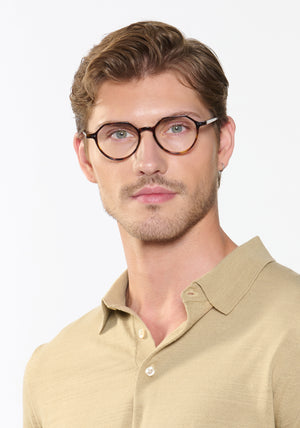 JOEL | Havana Handcrafted, luxury brown tortoise acetate small round octagonal KREWE eyeglasses mens model | Model: Linus