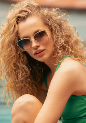 JOLENE | 12K Titanium + Selene Handcrafted, luxury titanium and light green acetate oversized butterfly KREWE sunglasses womens model campaign | Model: Tanya