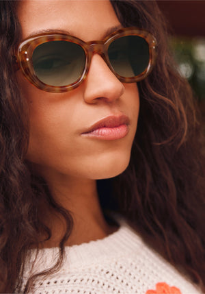 MARGARET | Fernet Handcrafted, luxury brown checkered tortoise acetate medium sized oval bubble frame KREWE sunglasses womens model campaign | Model: Morgan