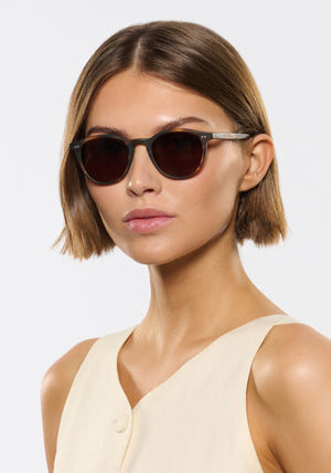 KREWE SUNGLASSES - LANDRY | Matte Hickory Polarized handcrafted, luxury round brown acetate polarized sunglasses womens model | Model: Michelle
