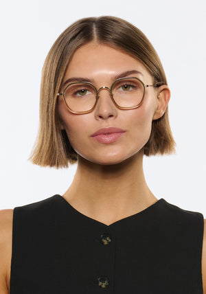 KREWE - LEIGHTON | 12K Titanium + Wasabi handcrafted, luxury green gradient octagonal eyeglasses with 12K gold plated metal hardware womens model campaign | Model: Michelle