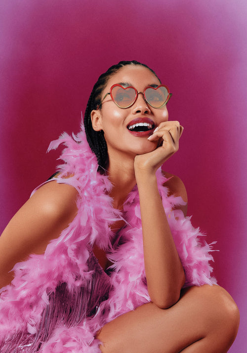 FAITHFUL | 18K + Cherry on Top Handcrafted, luxury, heart shaped red Mardi Gras acetate and 18K stainless steel KREWE sunglasses womens model | Model: May