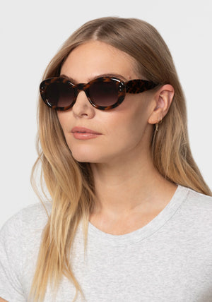 MARGARET | Venezia Handcrafted, luxury dark brown and black tortoise acetate medium sized oval bubble frame KREWE sunglasses womens model | Model: Maritza