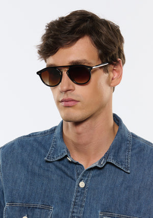 MARKLE | Black + Black Tea 18K Handcrafted, luxury black acetate medium round KREWE sunglasses with gold stainless steel metal hardware mens model | Model: Jegor