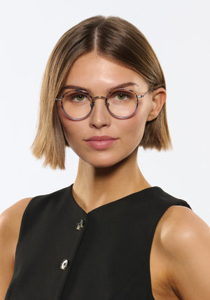 MAYFAIR | Matte Raw Titanium + Rhodes Handcrafted, luxury navy grey acetate and titanium round KREWE eyeglasses womens model | Model: Michelle