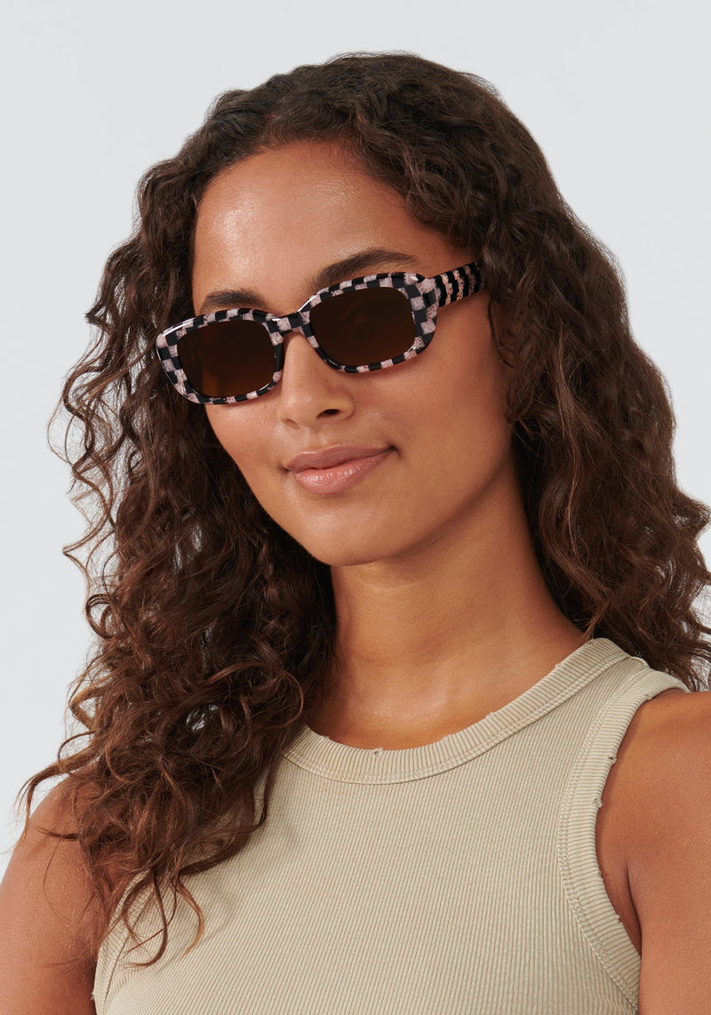 KREWE SUNGLASSES - MILAN | Harlequin to Petal handcrafted, pink and black checkered rectangular sunglasses womens model | Model: Meli
