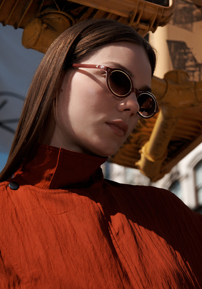 MUSE | Sauvage + 18K Handcrafted, luxury brown acetate and stainless steel small oval KREWE sunglasses womens model | Model: Becca