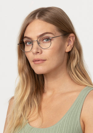 NELSON | Matte Raw Stainless Steel + Denim Handcrafted, luxury stainless steel oversized geometric round KREWE eyeglasses womens model | Model: Maritza
