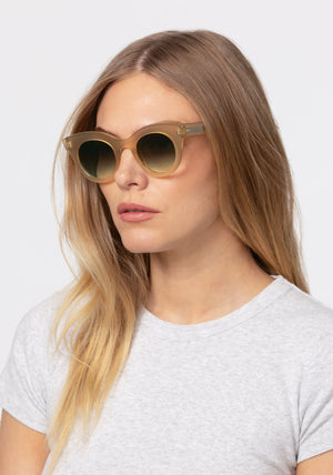 OLIVIA | Chamomile Handcrafted, luxury tan acetate round cat-eye KREWE sunglasses womens model | Model: Maritza