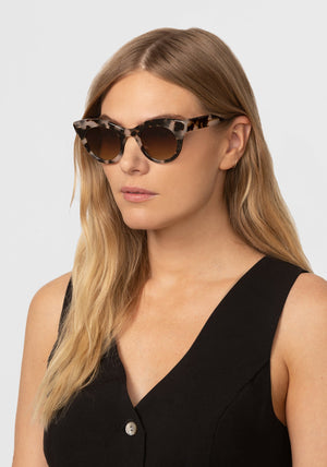 KREWE - OLIVIA | Malt Polarized handcrafted, luxury brown tortoise shell cat-eye sunglasses womens model campaign | Model: Maritza