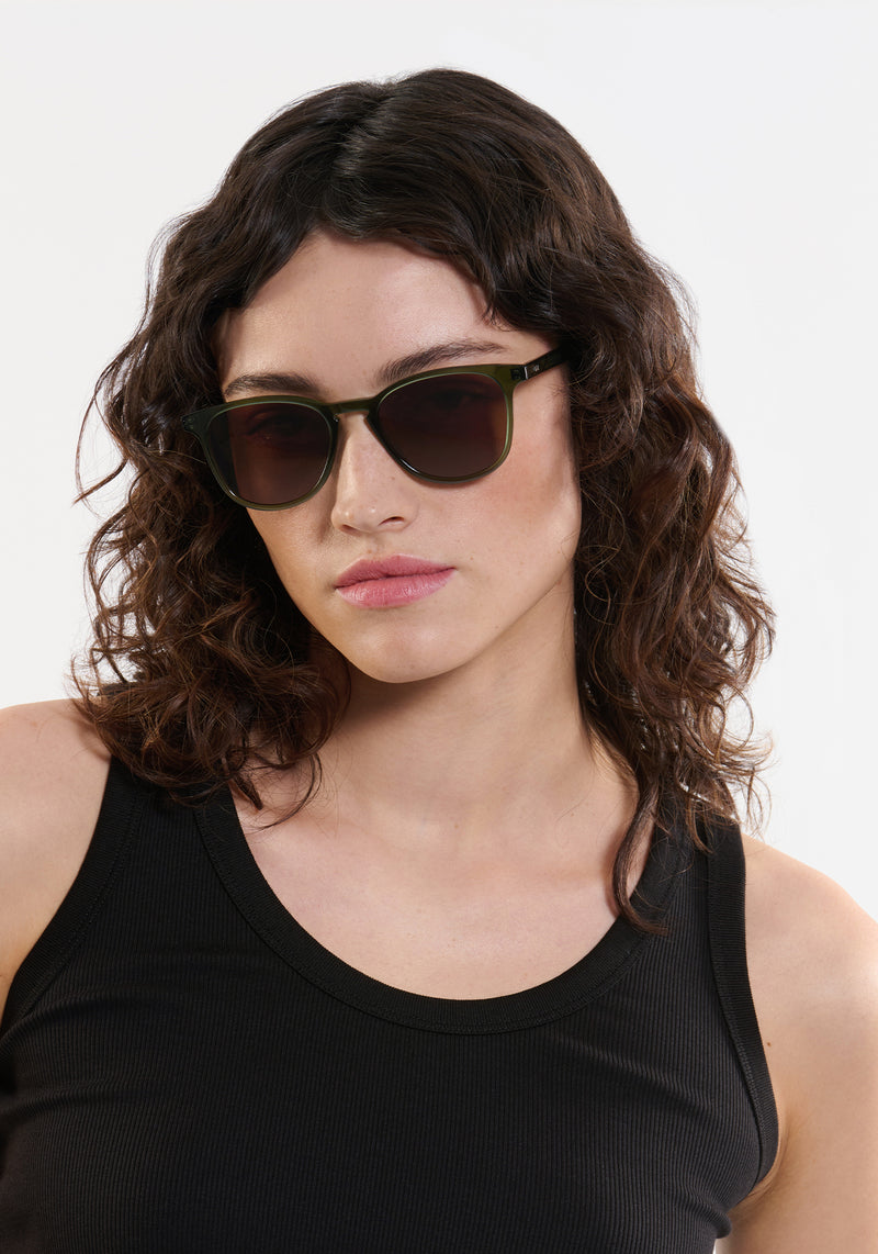 OLIVIER | Bottle Green Handcrafted, luxury green acetate round KREWE sunglasses womens model | Model: Ione