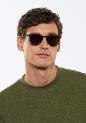 OLIVIER | Bottle Green Handcrafted, luxury green acetate round KREWE sunglasses mens model | Model: Jegor