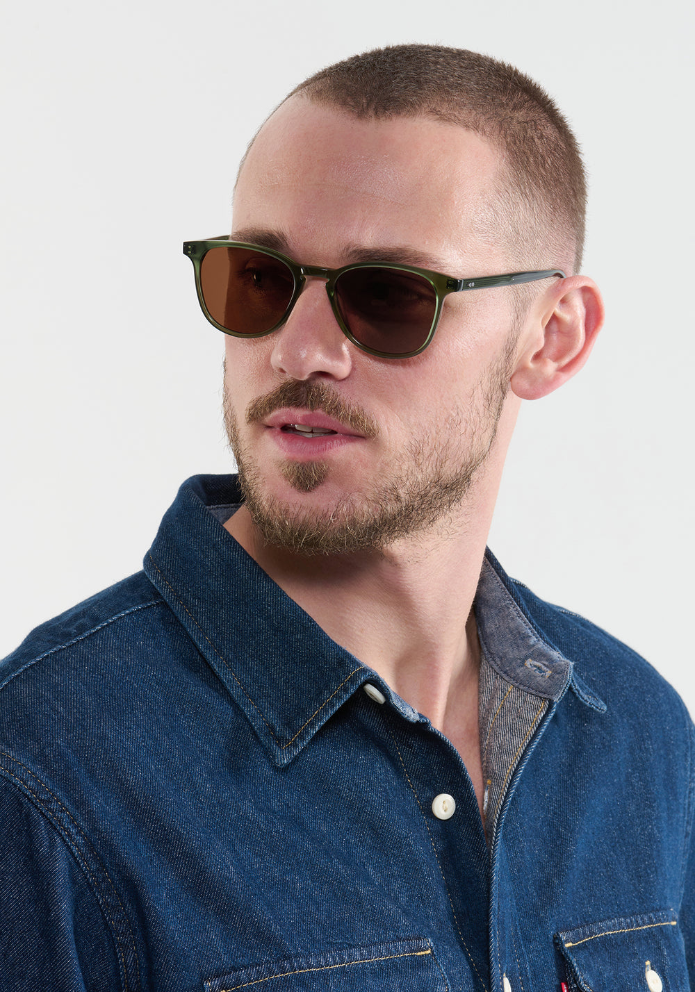 OLIVIER | Bottle Green Handcrafted, luxury green acetate round KREWE sunglasses mens model | Model: Connor