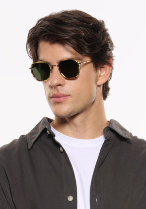 PEYTON | 12K Titanium + Tuscan Tortoise Handcrafted, luxury dark multicolored tortoise acetate and titanium geometric KREWE sunglasses  mens model | Model: Brent