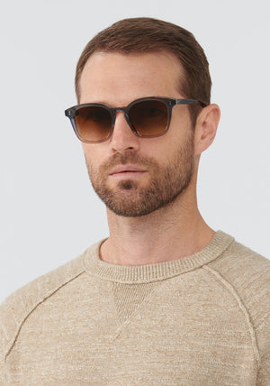 PRYTANIA | Oolong Handcrafted, luxury translucent grey blue amber gradient acetate KREWE sunglasses mens model | Model: Vince