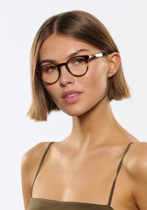 QUINN | Havana Handcrafted, luxury brown tortoise acetate round KREWE eyeglasses womens model | Model: Michelle