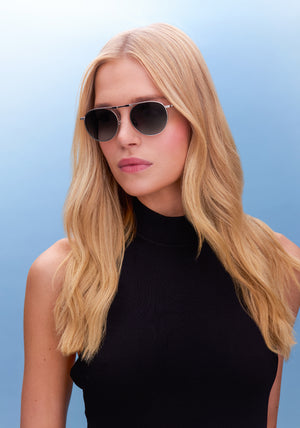 RAMPART FOLD | Silver + Nightfall Handcrafted, luxury stainless steel round folding aviator KREWE sunglasses womens model | Model: Emily U.