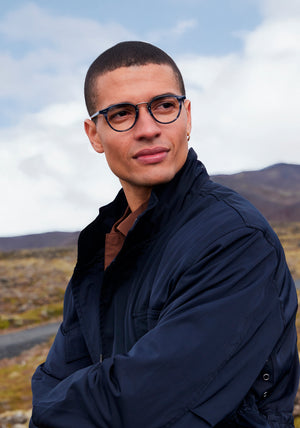 RILEY | Ripple Silver Handcrafted, luxury blue tortoise acetate round KREWE eyeglasses with silver stainless steel hardware mens model | Model: Vincent