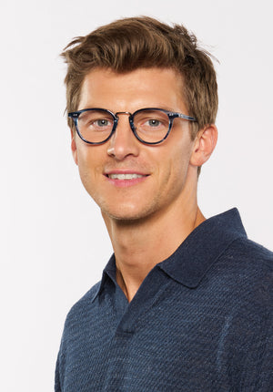 RILEY | Ripple Silver Handcrafted, luxury blue tortoise acetate round KREWE eyeglasses with silver stainless steel hardware mens model | Model: Ben
