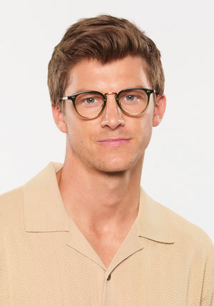RILEY | Shishito Handcrafted, luxury green gradient acetate round KREWE eyeglasses  with 12K stainless steel hardware mens model | Model: Ben