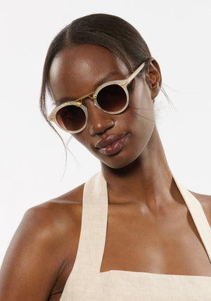 ST. LOUIS | Alabaster 18K Handcrafted, luxury light grey acetate round KREWE sunglasses with gold bridge and hardware womens model | Model: Brenda