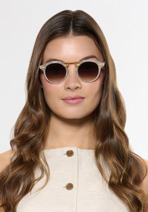 ST. LOUIS | Alabaster 18K Handcrafted, luxury light grey acetate round KREWE sunglasses with gold bridge and hardware womens model | Model: Kennidy