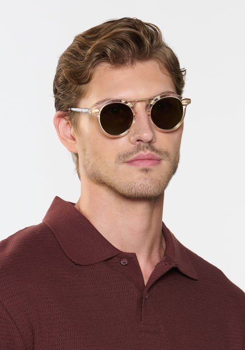 STL II | Haze + Iberia 12K Polarized Handcrafted, large round luxury champagne pearlescent acetate and 12K gold metal bridge KREWE sunglasses mens model | Model: Linus