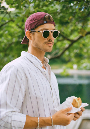 STL II | Haze + Iberia 12K Polarized Handcrafted, large round luxury champagne pearlescent acetate and 12K gold metal bridge KREWE sunglasses mens model | Model: Linus