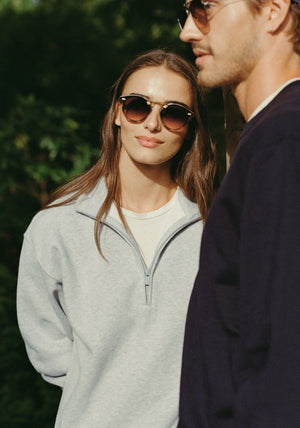 STL NYLON | Matte Blush Tort 18K Handcrafted, luxury pink and brown tortoise acetate round KREWE sunglasses with flat edge to edge nylon lens and 18k gold metal bridge womens model | Model: Sam