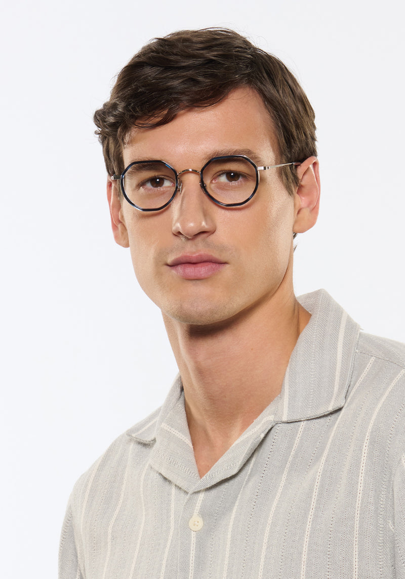 SIMON | Silver Titanium + Wake Handcrafted blue tortoise round geometric titanium and acetate KREWE eyeglasses mens model | Model: Jegor