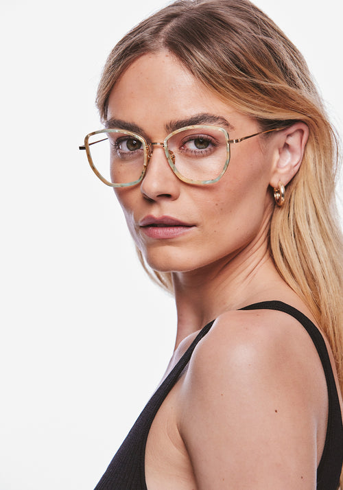 SKYLAR | 18K Titanium + Pearlescent Handcrafted, luxury ivory light blue pearl acetate and titanium medium sized butterfly KREWE eyeglasses womens model | Model: Meghan
