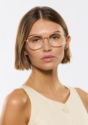 SKYLAR | 18K Titanium + Pearlescent Handcrafted, luxury ivory light blue pearl acetate and titanium medium sized butterfly KREWE eyeglasses womens model | Model: Michelle