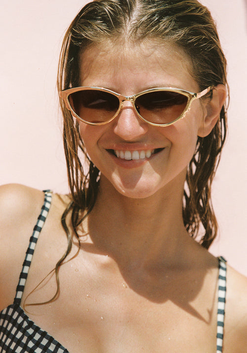SOLANGE | 18K Chroma + Champagne Handcrafted, luxury gold chroma stainless steel large cat eye KREWE sunglasses womens model | Model: Emily G.
