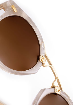 ST. LOUIS | Alabaster 18K Handcrafted, luxury light grey acetate round KREWE sunglasses with gold bridge and hardware womens model