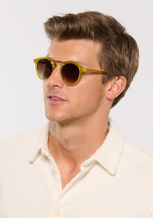 ST. LOUIS | Chartreuse 18K Handcrafted, luxury, yellow green acetate round KREWE sunglasses with gold bridge and hardware mens model campaign | Model: Ben