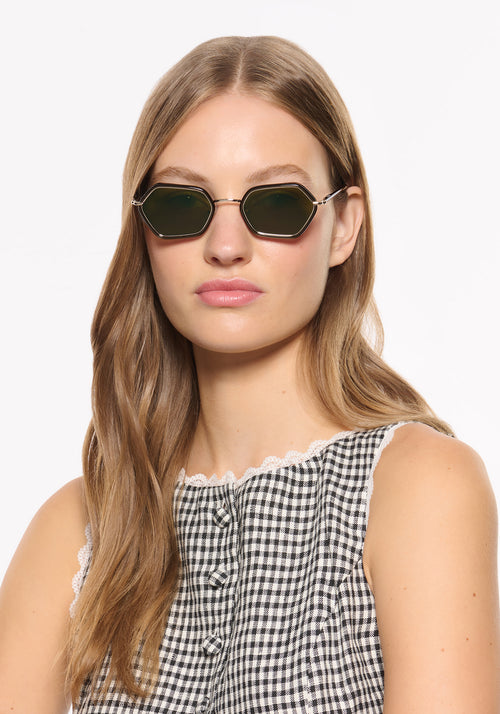 SUKIE | 12K + Bronze Metallic Handcrafted, luxury dark brown acetate and stainless steel small geometric KREWE sunglasses womens model | Model: Isa