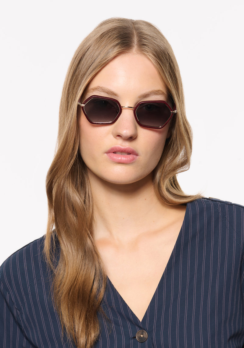 SUKIE | 12K + Burgundy Leather Handcrafted, luxury burgundy leather and stainless steel small geometric KREWE sunglasses womens model | Model: Isa