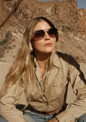 AUSTIN | Antique Gold Titanium + Brown Leather Handcrafted, luxury dark brown acetate and titanium aviator KREWE sunglasses womens model | Model: Tova