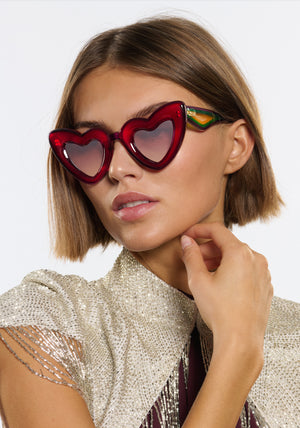TEMPTRESS | Rouge + Royale Mirror Vanity (Float Edition) Handcrafted, luxury red acetate oversized heart shaped Mardi Gras KREWE sunglasses womens model | Model: Michelle