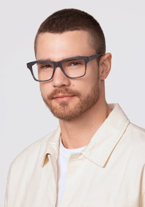 THEO | Matte Denim Handcrafted, luxury navy blue acetate oversized rectangular KREWE eyeglasses mens model | Model: David