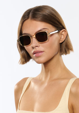 TOMMIE | Haze + Iberia Handcrafted, champagne pearlescent acetate square rectangle KREWE sunglasses womens model | Model: Michelle