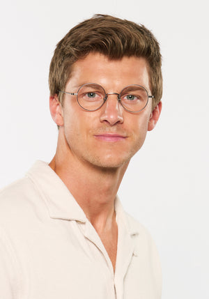 VIRGIL | Matte Raw Titanium Handcrafted, luxury matte raw titanium metal round KREWE eyeglasses mens model | Model: Ben