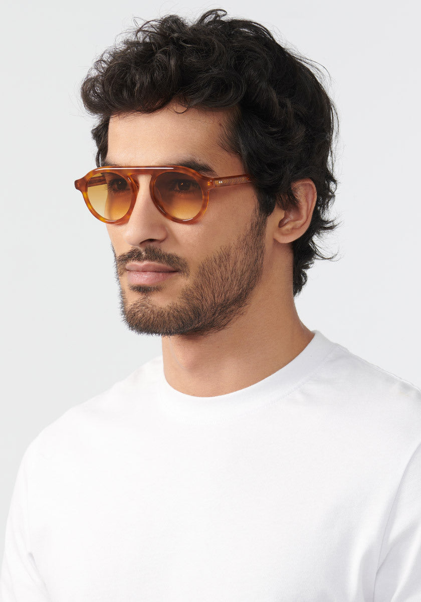 KREWE SUNGLASSES - CAMERON | Amaro + Custom Vanity Tint handcrafted, luxury orange round sunglasses with custom orange gradient tinted lenses mens model | Model: Mo