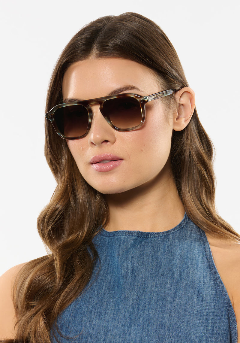 ZANDER | Aquamarine Tortoise Handcrafted, luxury blue and brown tortoise acetate large rectangular aviator KREWE sunglasses womens model | Model: Kennidy