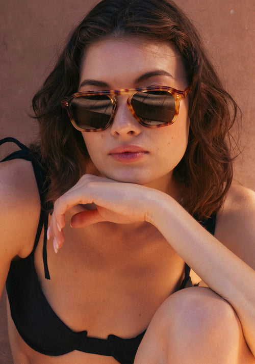 ZANDER | Hawksbill Handcrafted, luxury brown and tan tortoise acetate large rectangular aviator KREWE sunglasses womens model campaign | Model: Kennidy