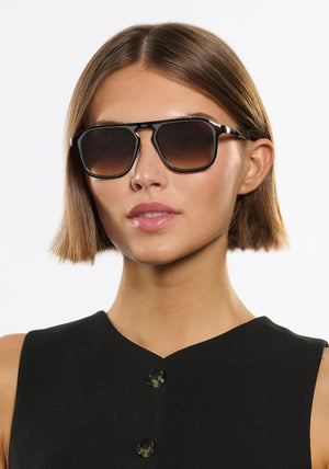 ZANDER CHROMA | Gunmetal Chroma + Black Tea Handcrafted, luxury dark brown polished chrome stainless steel large square aviator KREWE sunglasses womens model | Model: Michelle